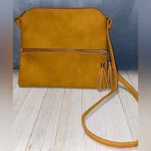 Yellow tassel shoulder bag